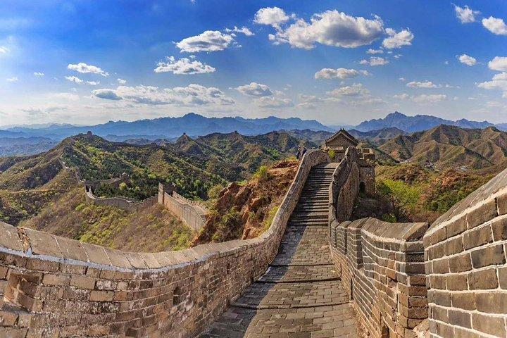 A stone walkway and watchtowers on the Great Wall in daylight
